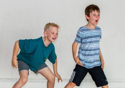 Photo of two boys rehearsing in full colour