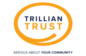 Trillian Trust logo in orange and black letters