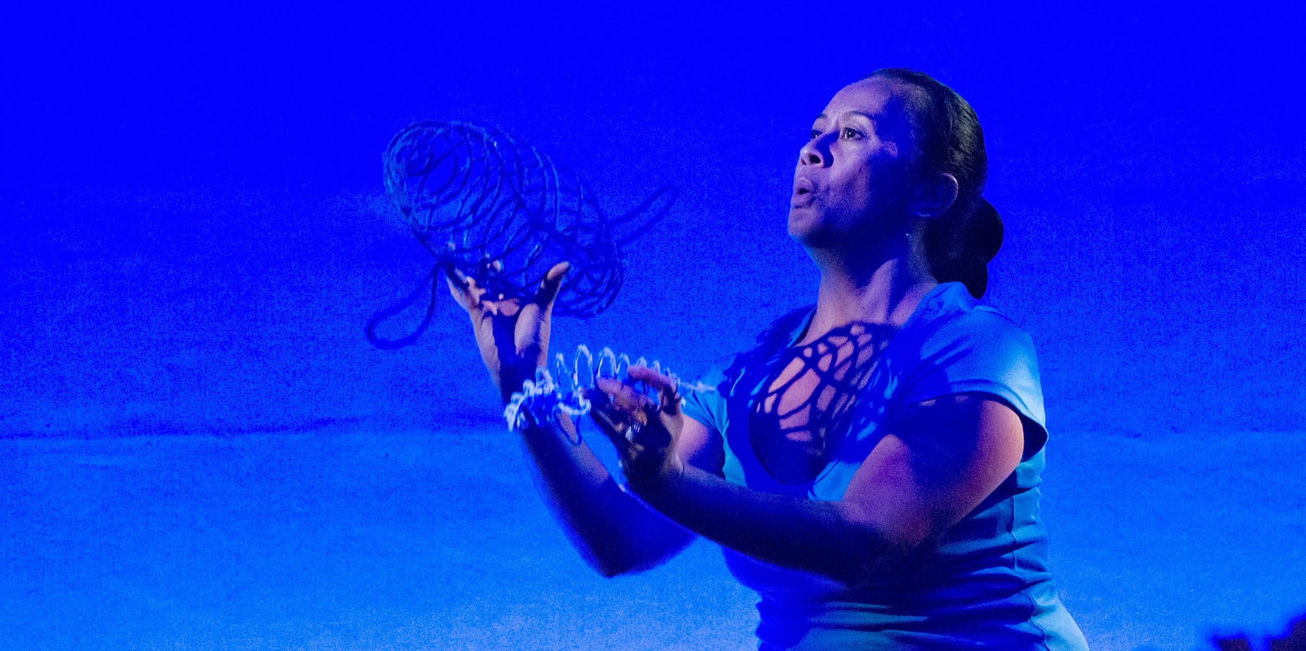 Photo of The Whale Rider on stage in blue