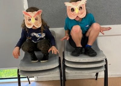 EC students wearing owl masks